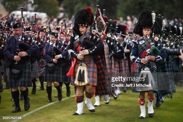 Mass pipe bands play at the annual Braemer Highland Games at The Princess Royal and Duke of Fife Memorial Park on September 1, 2018in Braemar,...