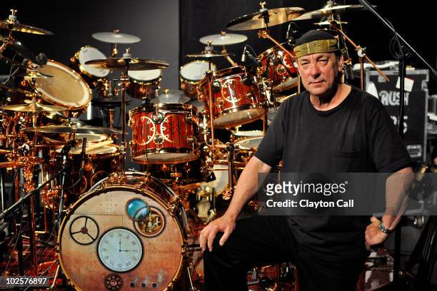 Neil Peart of Rush poses for a portrait with his DW drum kit on the Drum Channel soundstage on May 12, 2010 in Oxnard, California, United States.
