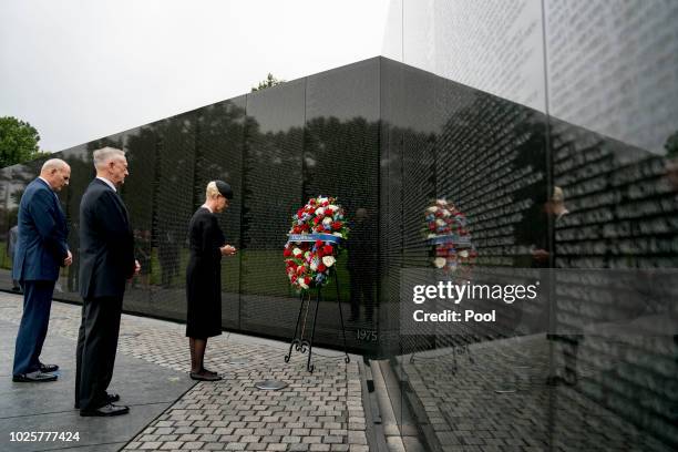 Cindy McCain, wife of, Sen. John McCain, R-Ariz., accompanied by President Donald Trump's Chief of Staff John Kelly, left, and Defense Secretary Jim...