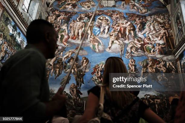 People walk through the Sistine Chapel at the Vatican Museums on September 01, 2018 in Vatican City, Vatican. Tensions in the Vatican are high...