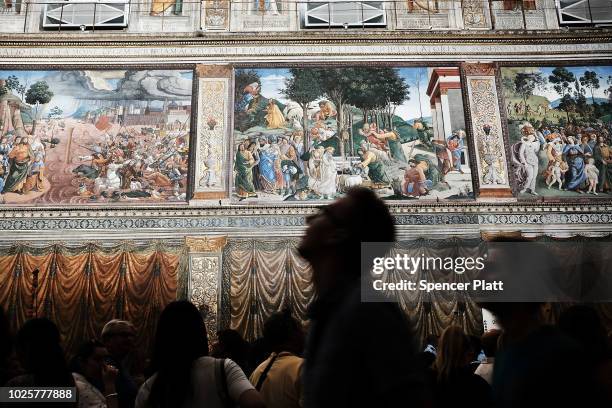 People walk through the Sistine Chapel at the Vatican Museums on September 01, 2018 in Vatican City, Vatican. Tensions in the Vatican are high...