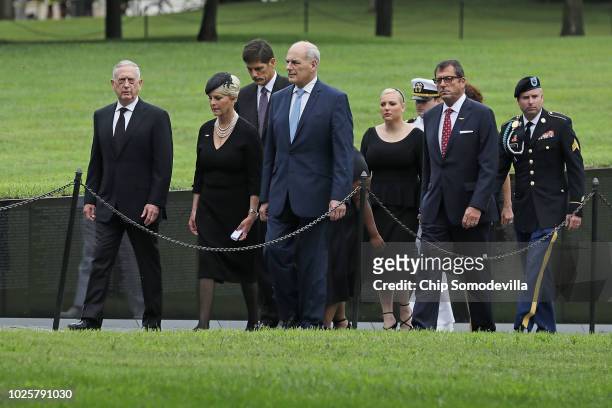 Cindy McCain is escorted by U.S. Defense Secretary James Mattis and White House Chief of Staff John Kelly and her children and step-children after...