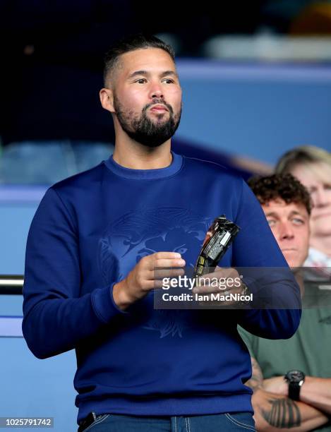 Professional Boxer Tony Bellew looks on from the stands prior to the Premier League match between Everton FC and Huddersfield Town at Goodison Park...