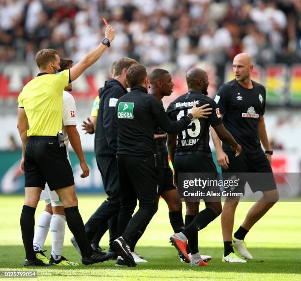 Jetro Willems of Eintracht Frankfurt is shown a red card by referee Sören Storks during the Bundesliga match between Eintracht Frankfurt and SV...