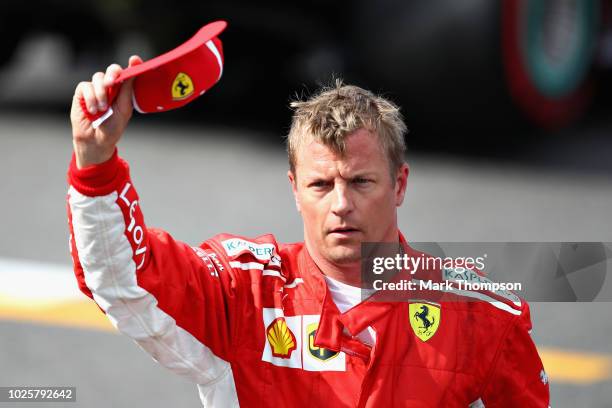 Pole position qualifier Kimi Raikkonen of Finland and Ferrari celebrates in parc ferme during qualifying for the Formula One Grand Prix of Italy at...