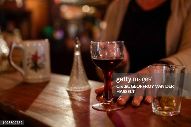 Lynda, an ex-madam and actual owner of the Cotton Club bar, formerly an escort-girl bar, sits in her establishment in the Pigalle area of Paris, on...