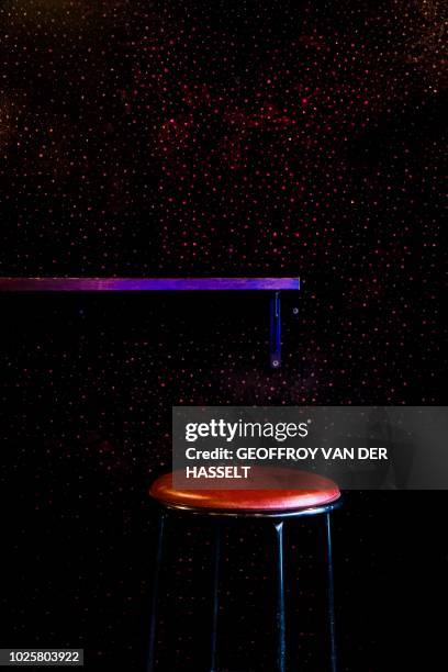 Picture shows a stool and a fabric wall in the Pile ou Face bar, formerly an escort-girl bar, in the Pigalle area of Paris on July 5, 2018. - In the...