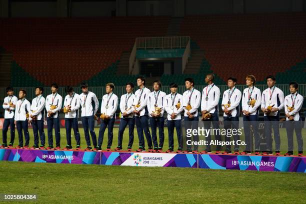 Players of South Korea line up after winning their gold medals after defeating Japan 2-1 in extra time during the Men's Football gold medal match...