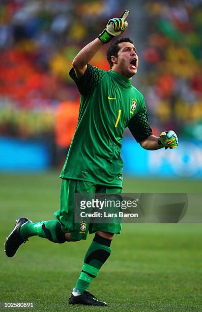 Julio Cesar of Brazil celebrates Robinho's opening goal during the 2010 FIFA World Cup South Africa Quarter Final match between Netherlands and...