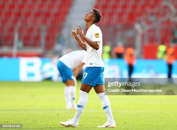 Felix Uduokhai of VfL Wolfsburg celebrates following his sides victory in the Bundesliga match between Bayer 04 Leverkusen and VfL Wolfsburg at...