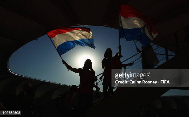 Netherlands fans wave their flags during the 2010 FIFA World Cup South Africa Quarter Final match between Netherlands and Brazil at Nelson Mandela...
