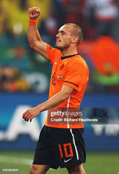 Wesley Sneijder of the Netherlands celebrates the own goal by Felipe Melo of Brazil during the 2010 FIFA World Cup South Africa Quarter Final match...