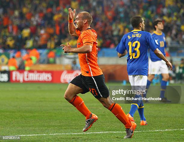 Wesley Sneijder of the Netherlands celebrates scoring his side's second goal during the 2010 FIFA World Cup South Africa Quarter Final match between...