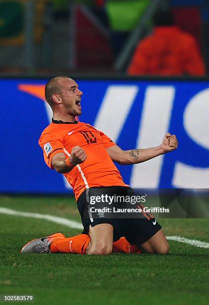 Wesley Sneijder of the Netherlands celebrates scoring his team's second goal during the 2010 FIFA World Cup South Africa Quarter Final match between...