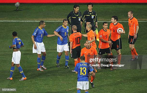 Felipe Melo of Brazil begins to walk off the pitch after a challenge on Arjen Robben of the Netherlands and is given a red card during the 2010 FIFA...