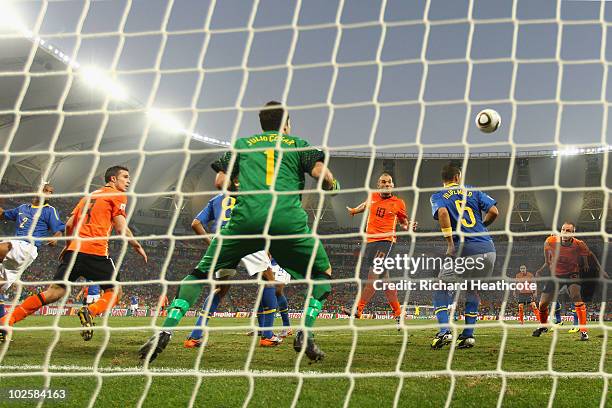 Wesley Sneijder of the Netherlands scores his team's second goal during the 2010 FIFA World Cup South Africa Quarter Final match between Netherlands...