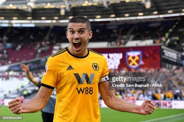 Conor Coady of Wolverhampton Wanderers celebrates at full time during the Premier League match between West Ham United and Wolverhampton Wanderers at...
