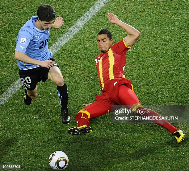 Ghana's striker Kevin-Prince Boateng fights for the ball with Uruguay's midfielder Alvaro Fernandez during the quarter final 2010 World Cup match...