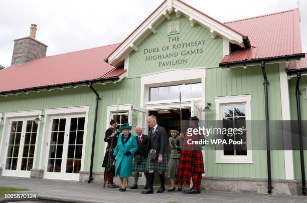 Queen Elizabeth II and Prince Charles, Prince of Wales, the Duke of Rothesay leave after they officially opened the Duke of Rothesay Highland Games...