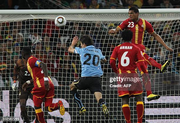 Uruguay's midfielder Alvaro Fernandez heads the ball in front of Ghana's goalkeeper Richard Kingson during the 2010 World Cup quarter-final match...