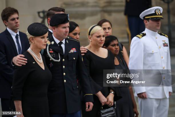 Cindy McCain, her son James McCain, daughter Meghan McCain, Bridget McCain and John Sidney McCain IV look on as the casket of the late Senator John...