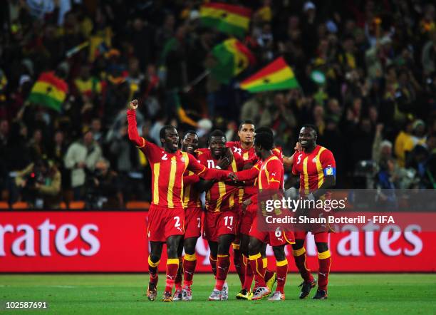 Sulley Muntari of Ghana celebrates with team mates after he scores his side's first goal during the 2010 FIFA World Cup South Africa Quarter Final...