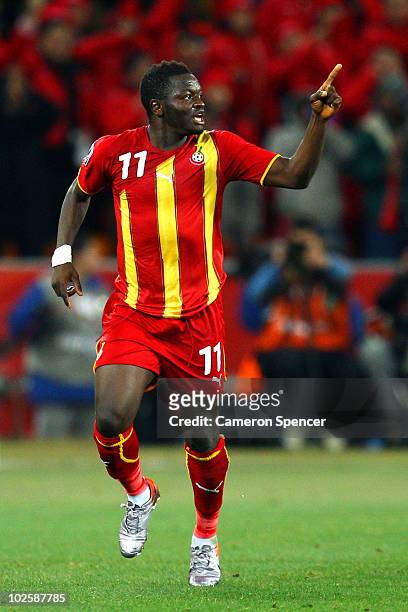 Sulley Muntari of Ghana celebrates scoring the opening goal with team mates during the 2010 FIFA World Cup South Africa Quarter Final match between...