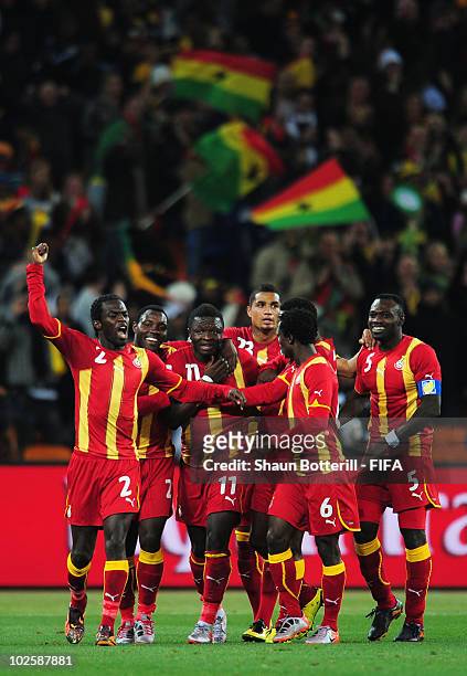 Sulley Muntari of Ghana celebrates with team mates after he scores his side's first goal during the 2010 FIFA World Cup South Africa Quarter Final...