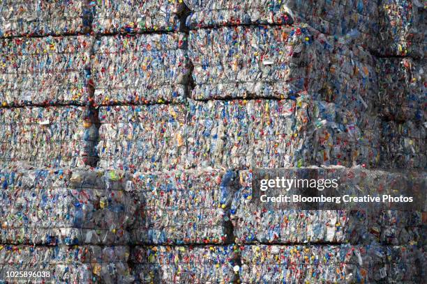 Bound bales of crushed plastic bottles and containers
