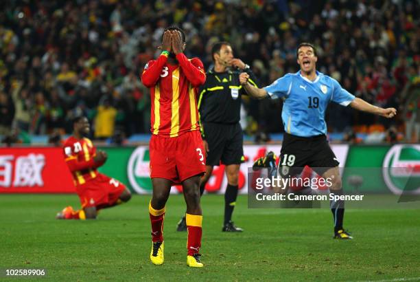 Asamoah Gyan of Ghana reacts as he misses a late penalty kick in extra time to win the match during the 2010 FIFA World Cup South Africa Quarter...
