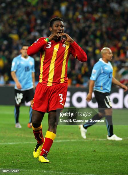 Asamoah Gyan of Ghana reacts as he misses a late penalty kick in extra time to win the match during the 2010 FIFA World Cup South Africa Quarter...