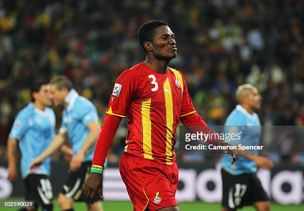 Asamoah Gyan of Ghana reacts after he misses a late penalty kick in extra time during the 2010 FIFA World Cup South Africa Quarter Final match...
