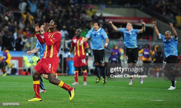 Asamoah Gyan of Ghana reacts as he misses a late penalty kick in extra time to win the match during the 2010 FIFA World Cup South Africa Quarter...