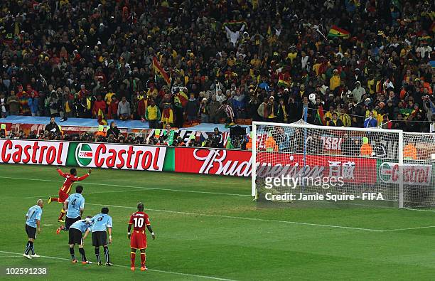Asamoah Gyan of Ghana shoots his penalty onto the crossbar after Luis Suarez of Uruguay handles the ball off the line and is sent off during the 2010...