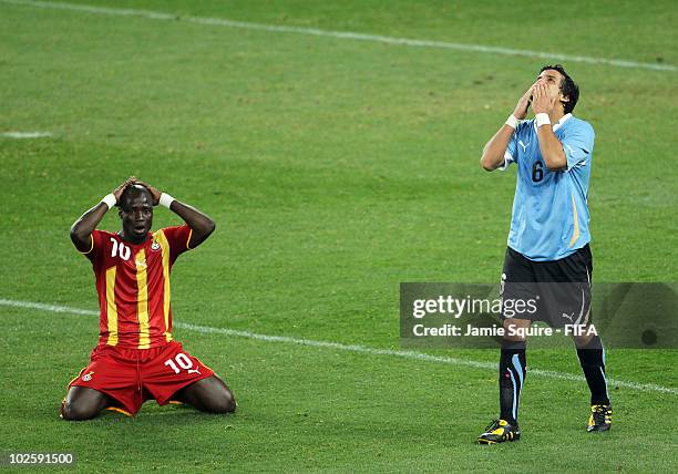 Dejected Stephen Appiah of Ghana as Mauricio Victorino of Uruguay celebrates after his team wins the penalty shoot out and progress to the semi...