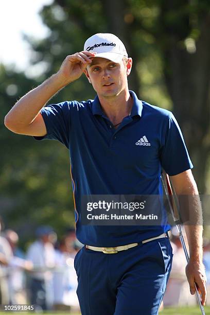 Justin Rose of England tips his cap after he finished the 18th hole during the second round of the AT&T National at Aronimink Golf Club on July 2,...