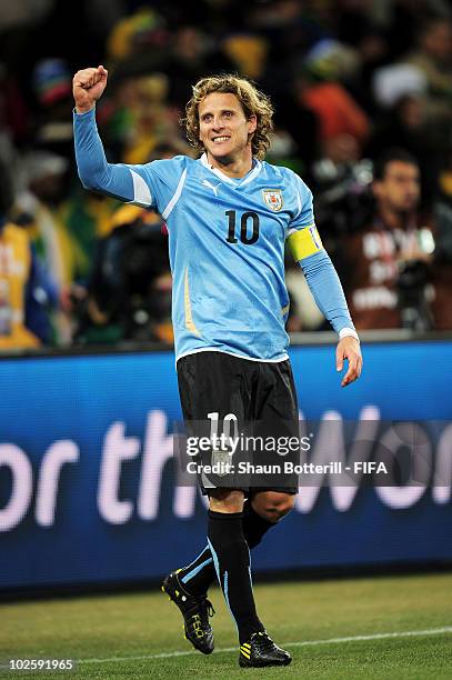 Diego Forlan of Uruguay celebrates winning the penalty shoot out and progress to the semi finals during the 2010 FIFA World Cup South Africa Quarter...