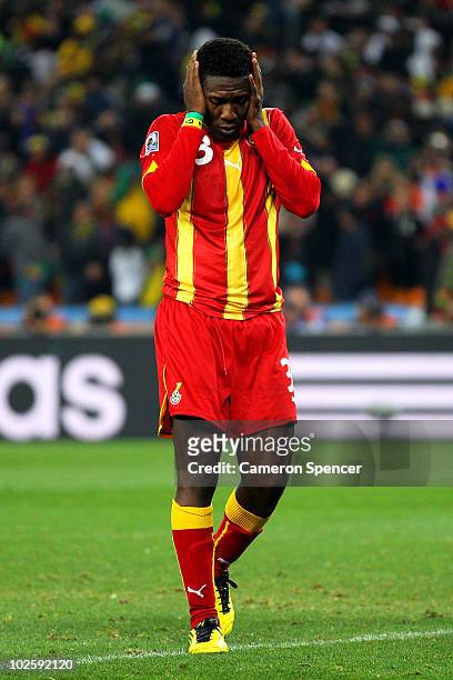 Asamoah Gyan of Ghana looks dejected after missing his penalty during the 2010 FIFA World Cup South Africa Quarter Final match between Uruguay and...