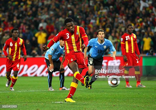 Asamoah Gyan of Ghana shoots a late penalty high during the 2010 FIFA World Cup South Africa Quarter Final match between Uruguay and Ghana at the...