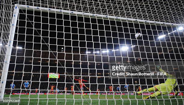 Asamoah Gyan of Ghana shoots his penalty onto the crossbar after Luis Suarez of Uruguay handles the ball off the line and is sent off during the 2010...