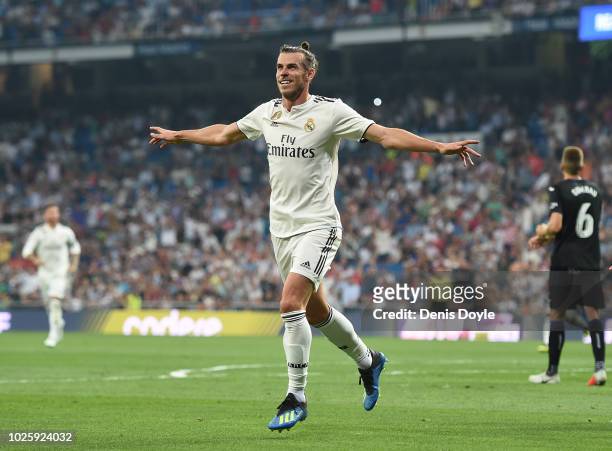 Gareth Bale of Real Madrid celebrates after scoring his teams opening goal during the La Liga match between Real Madrid CF and CD Leganes at Estadio...