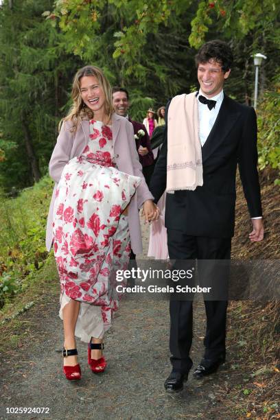 Mafalda Millies and her boyfriend Louis Khahane leave the wedding of Prince Konstantin of Bavaria and Princess Deniz of Bavaria, born Kaya, at the...