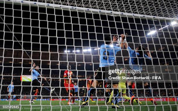 Luis Suarez of Uruguay handles the ball on the goal line, for which he is sent off during the 2010 FIFA World Cup South Africa Quarter Final match...