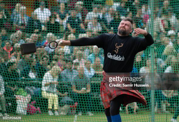 Competitor takes part in the 2018 Braemar Highland Gathering at The Princess Royal and Duke of Fife Memorial Park on September 1, 2018 in Braemar,...