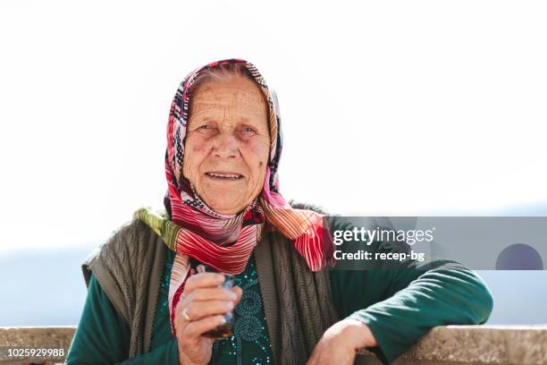 turkish senior woman smiling for camera - turkish stock pictures, royalty-free photos & images