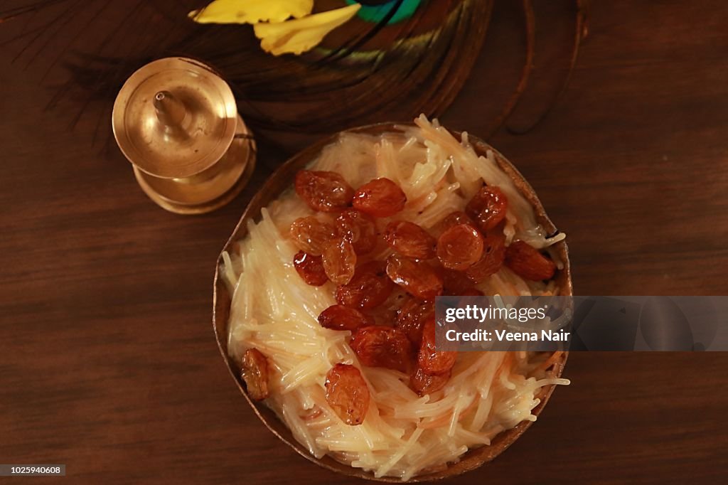 Vermicelli pudding/kheer with marigold flowers and brass lamp