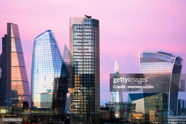 futuristic skyline of london city at twilight - multiple exposure - 20 fenchurch street stockfoto's en -beelden