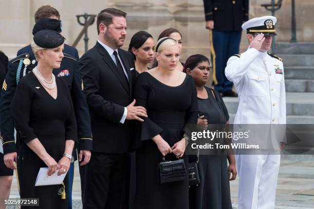 Cindy McCain, left, the wife of the late Sen. John McCain, R-Ariz., their son, Jack, far right, daughters Meghan and Bridget, second from right,...