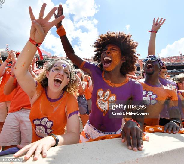 Clemson Tigers fans raise four fingers prior to the start of the fourth quarter of the Tigers' football game against the Furman Paladins at Clemson...