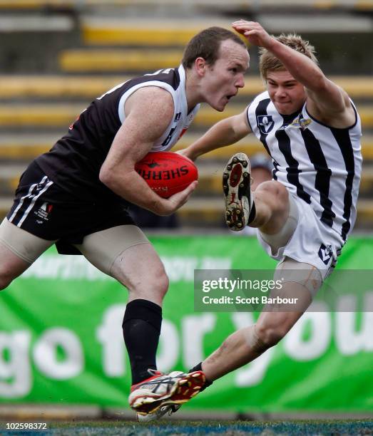 Stephen Clifton of North Ballarat runs with the ball during the round 11 VFL match between Collingwood and North Ballarat at Victoria Park on July 3,...